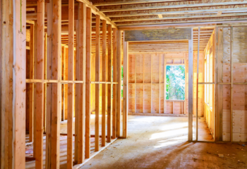 photo of interior of wood-frame house being built