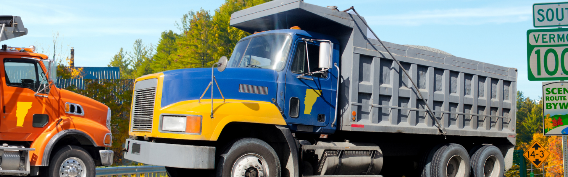 two dump trucks facing each other