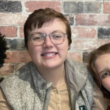 photo of Lukas between his siblings