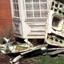photo of the damaged furniture on the front lawn of a building that could be town offices in Vermont