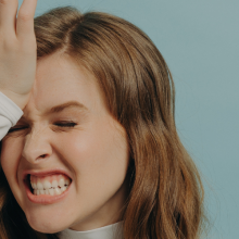 frustrated woman with hand on forehead