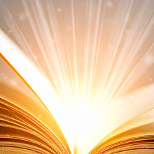 light emitting from the middle of an open book