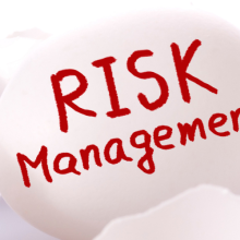 Risk management. Egg and broken egg shells on white background.