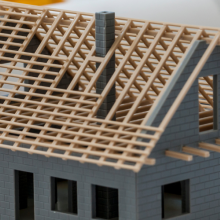 unfinished house sitting on development plans