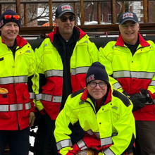 Woodstock firefighters accompany their department’s antique fire engine during Wassail Weekend 2025