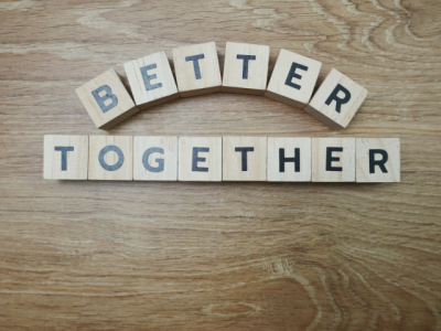 wood blocks with letters reading "Better Together"