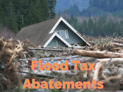 roof of home amid river debris with "Flood Tax Abatements"