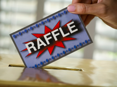 raffle ticket being put into entry box