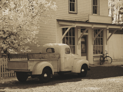 historic general store with pickup truck