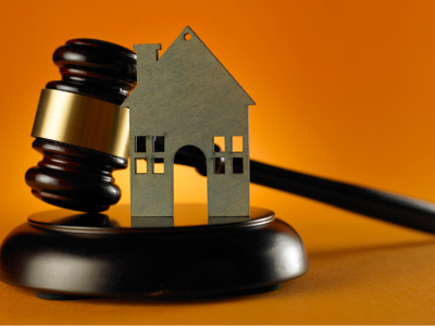 photo of a gavel and a small model of a house