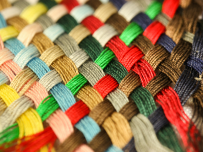 photo of multi-color woven threads