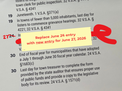 closeup photo of the wrong info the wall calendar covered by a note "Replace June 24 entry with new entry for June 27, 2026"