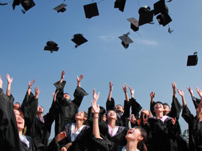 Graduates Throwing Mortarboards in the Air