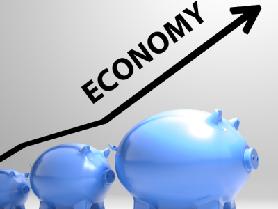 ECONOMY and rising arrow above piggy banks 