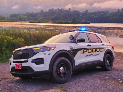 police cruiser in front of water scene