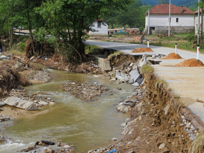 road eroded by stream flooding