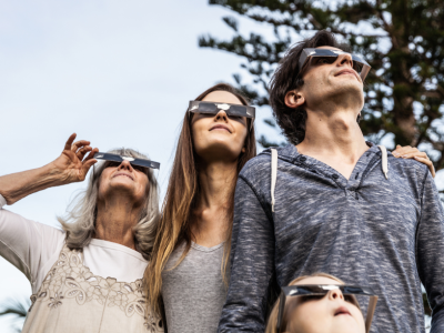 photo of family using eclipse safety eyewear