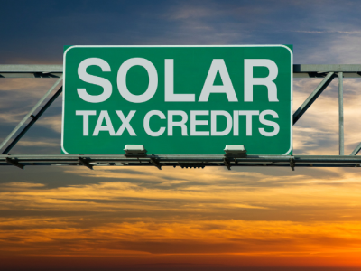 highway sign reading "solar tax credits"
