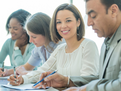 photo of four people working at one table