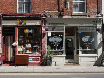 two storefronts along a street