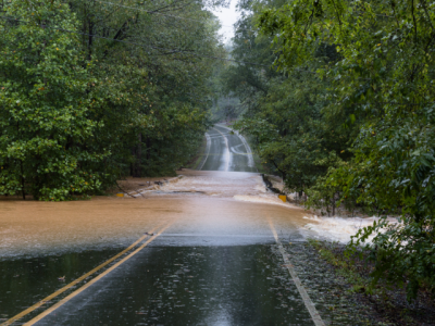 floodwater covering road at bridge