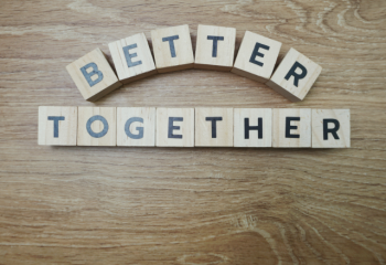 wood blocks with letters reading "Better Together"