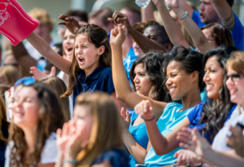 audience cheering at a school game