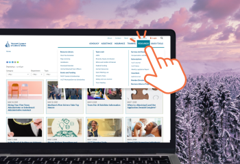 snowy background VLCT website on laptop in foreground