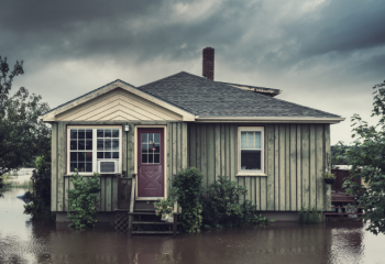 house surrounded by floodwater
