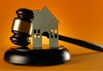 photo of a gavel and a small model of a house