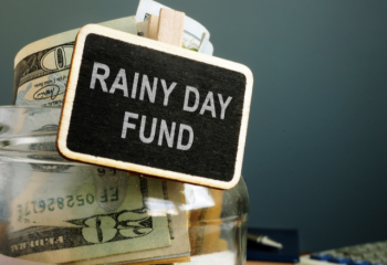 rainy day fund savings jar with cash
