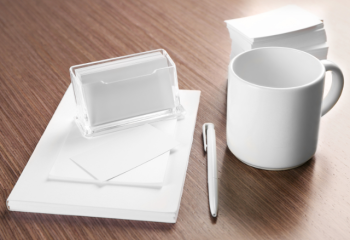 white paper, business cards, mug, and pen to be re-branded