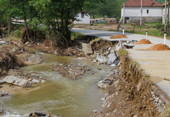 road eroded by stream flooding