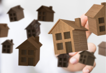 models of simple houses floating in air