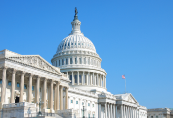 US Capitol building set against a clear blue sky