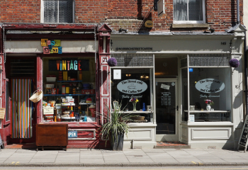 two storefronts along a street