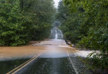 stormwater over blocked bridge