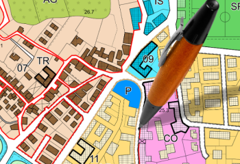 multi-colored zoning districts with pen standing upright in center