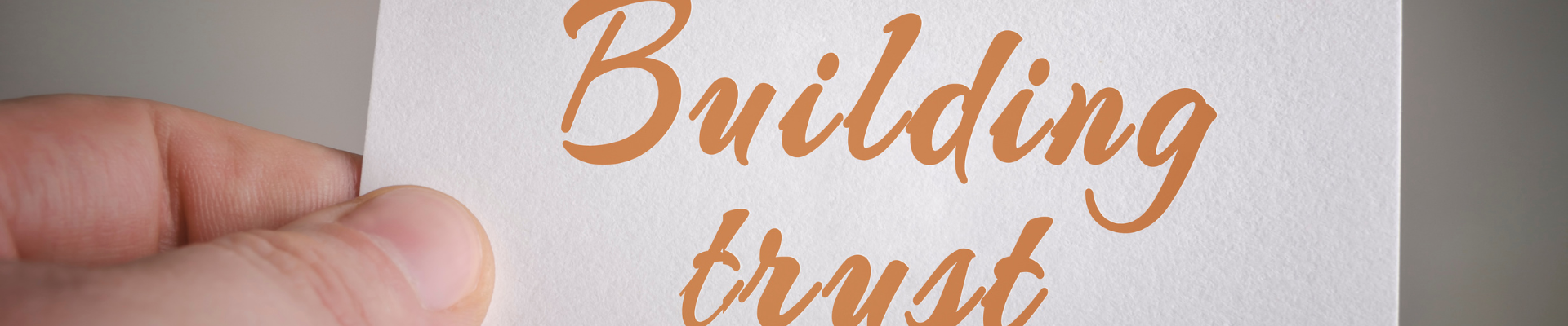 building trust card in hand