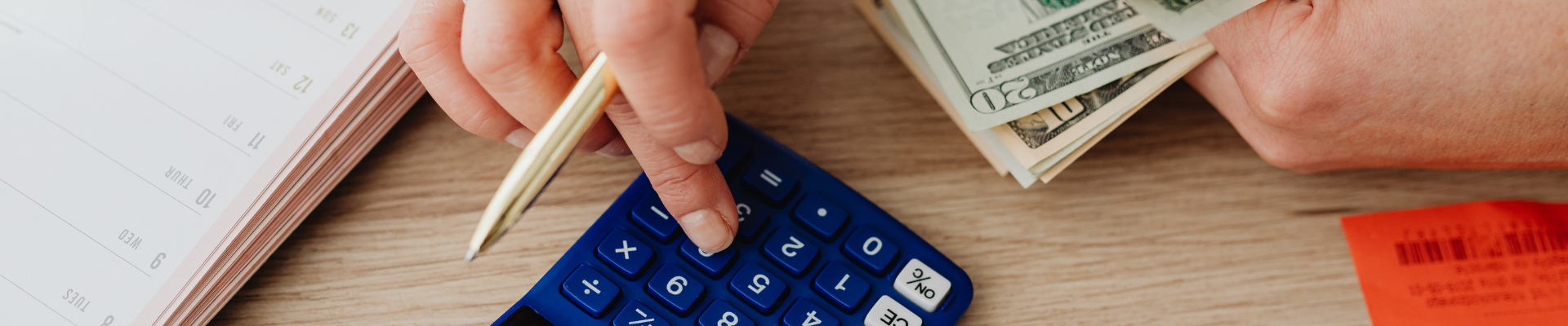 woman calculating money and receipts using calculator