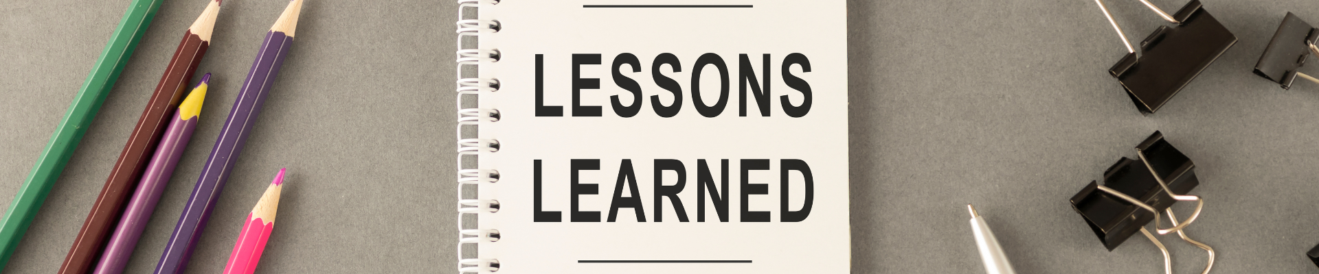 lessons learned concept written on notebook