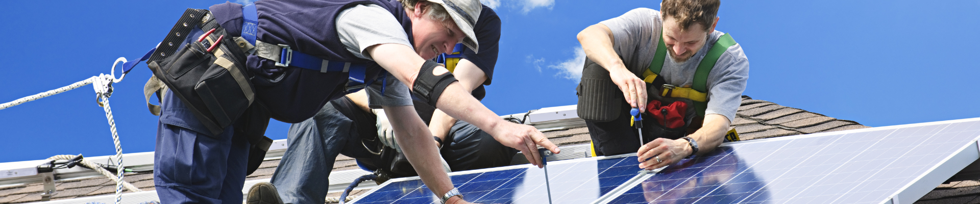 men installing rooftop solar