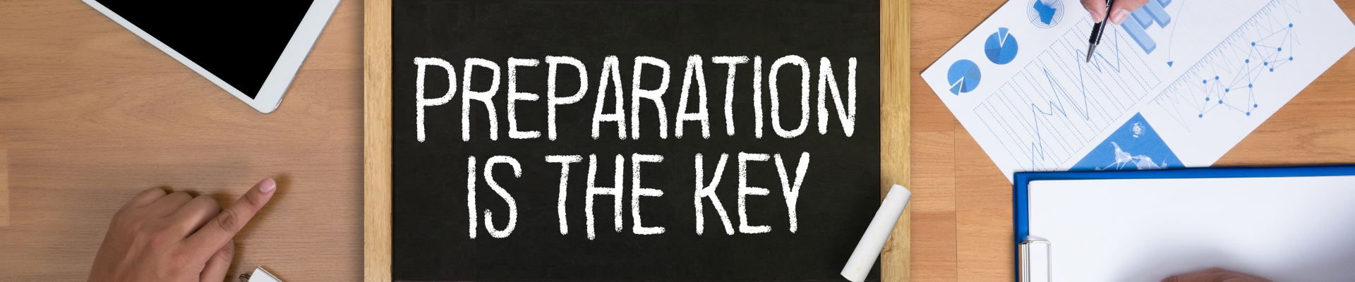 sign reading "preparation is the key"