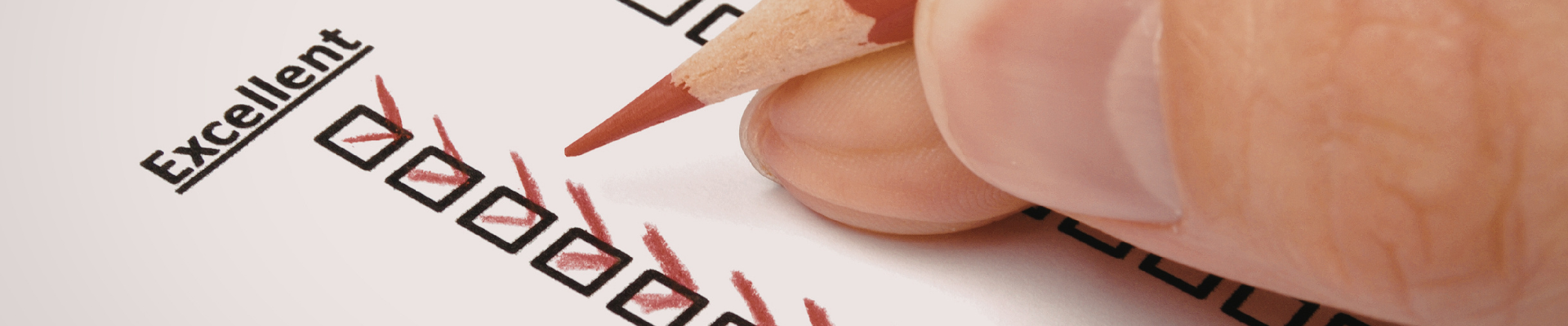 hand holding pencil and completing an assessment