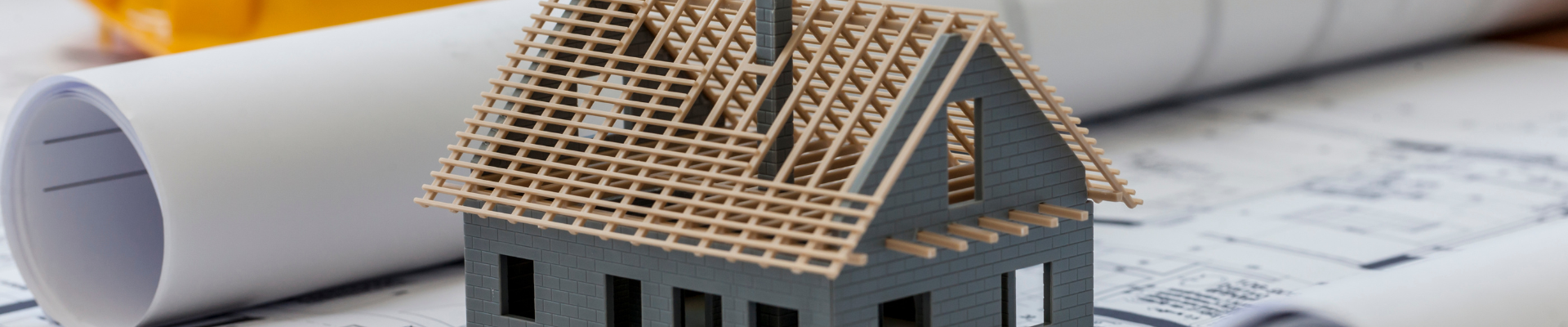 unfinished house sitting on development plans