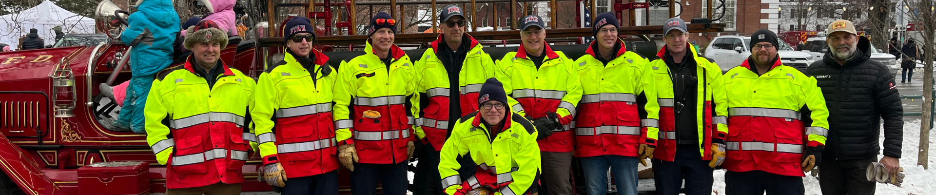 Woodstock firefighters accompany their department’s antique fire engine during Wassail Weekend 2025