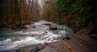 photo of road washed out by floodwaters