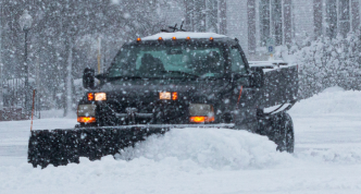 private snowplow clearing snow on private property