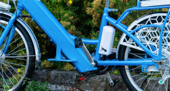 photo closeup of an e-bike's down tube, where its motor and battery are located