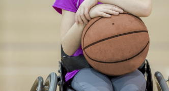 photo of young girl ready to play wheelchair basketball